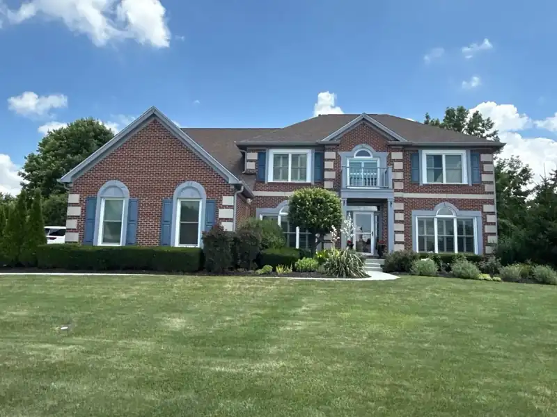 New asphalt shingle roof installed by Multi-Family Roofing on a brick home in the Indianapolis area