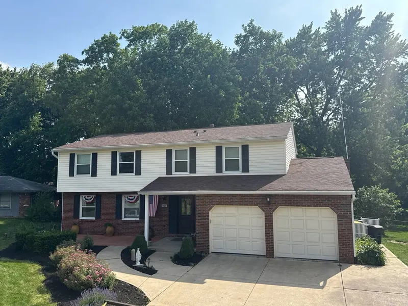 Two-story home with a brand new brown architectural shingle roof
